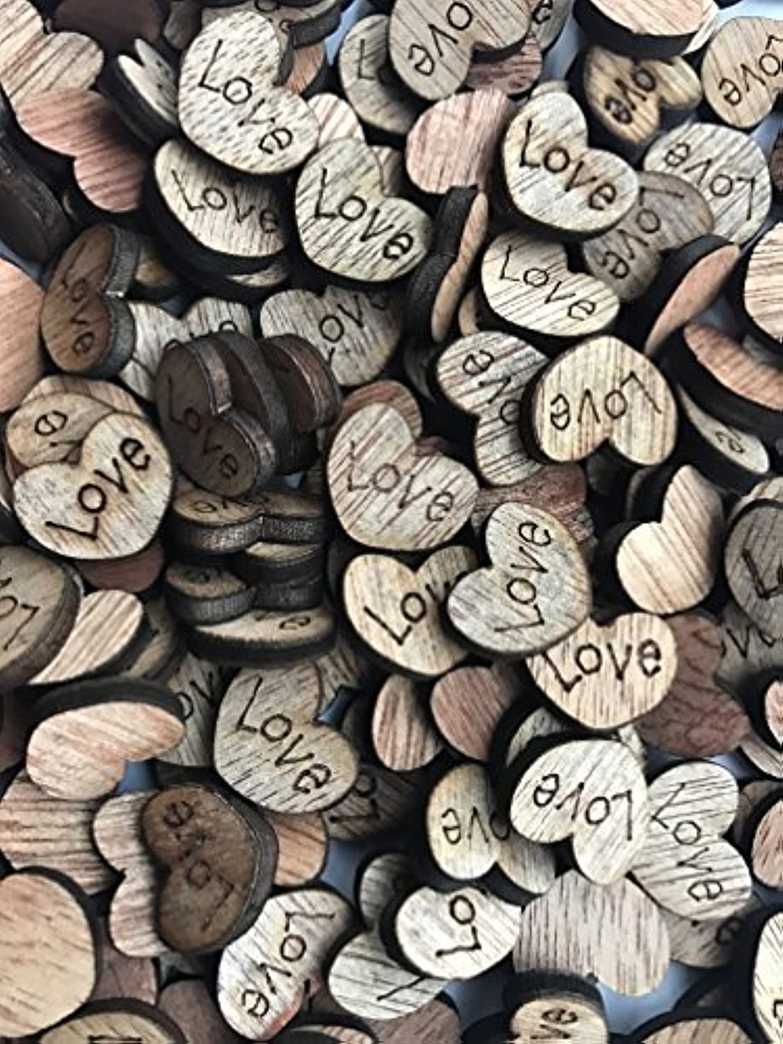 Wooden hearts with word "love" craft pieces
